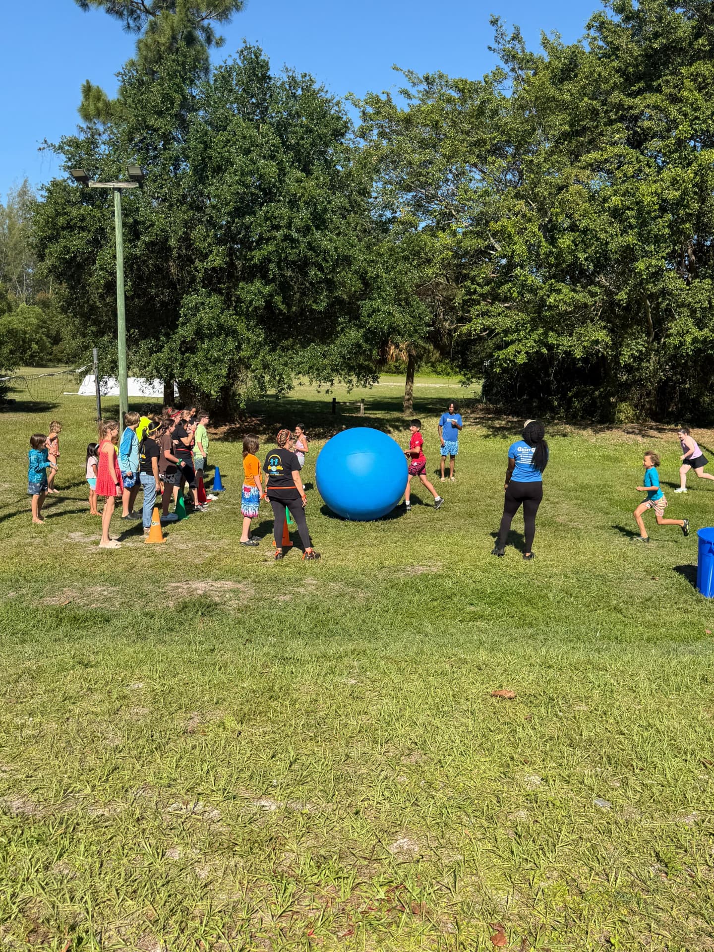 Connect students playing together during a field day activity