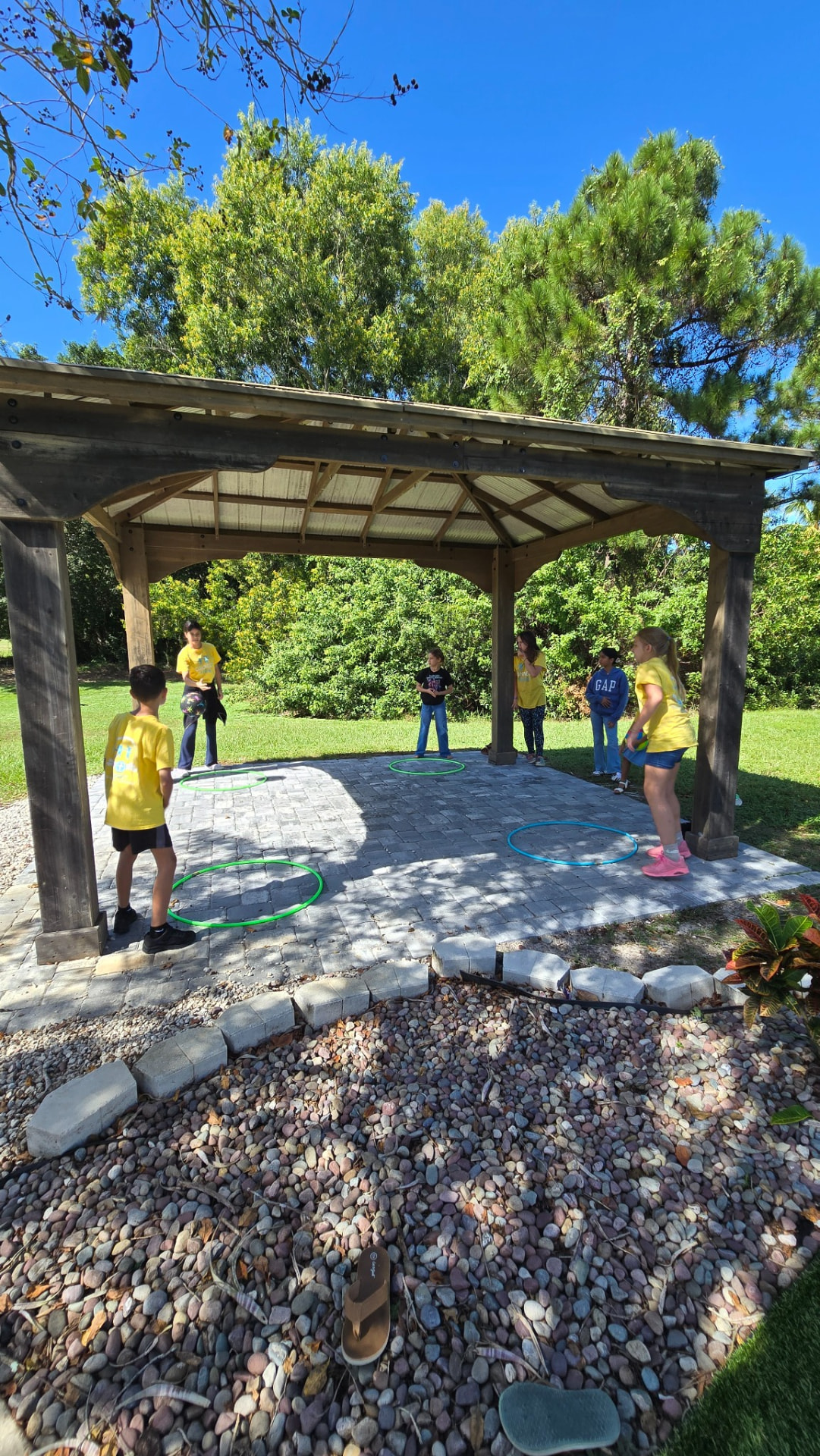 Connect students playing a group game under the pavilion