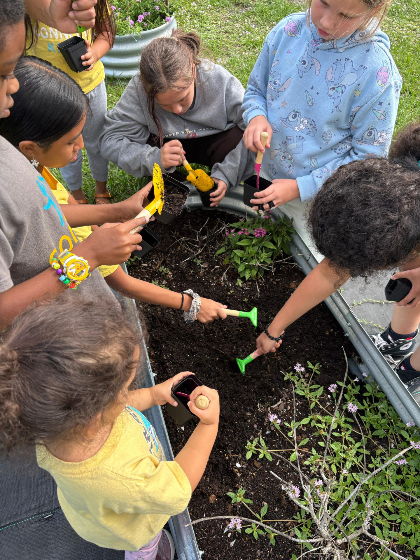 Connect students learning together during a garden activity